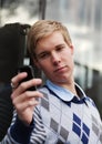 Young guy with cameraphone Royalty Free Stock Photo