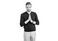 Young guy in casual style keep hands clasped together isolated on white, praying Royalty Free Stock Photo