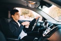 A young guy with a coffee drive while travel