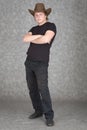 Young guy in cowboy hat on grey background Royalty Free Stock Photo