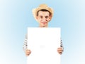 A young guy is holding a blank billboard Royalty Free Stock Photo