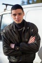 A young guy of criminal appearance in a black leather jacket Royalty Free Stock Photo