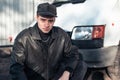 A young guy of criminal appearance in a black leather jacket Royalty Free Stock Photo