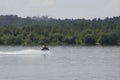 In waves and guy cruising on the atlantic ocean on a jet ski Royalty Free Stock Photo