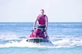 Young guy cruising on a jet ski Royalty Free Stock Photo