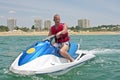 Young guy cruising on a jet ski Royalty Free Stock Photo