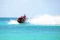 Young guy cruising on a jet ski on the caribbean sea Royalty Free Stock Photo