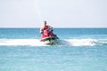 Young guy cruising on a jet ski Royalty Free Stock Photo