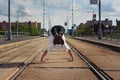 Young guy dancing breakdance on tramlines in the city Royalty Free Stock Photo