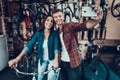 Young Guy and Girl Make Selfie at Bicycle Store