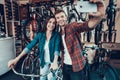 Young Guy and Girl Make Selfie at Bicycle Store