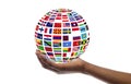 Young guy holding globe made of international flags, isolated on white, collage Royalty Free Stock Photo