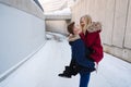 Young guy holds a beautiful girl in his arms. Royalty Free Stock Photo