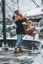 Young guy holds a beautiful girl in his arms Royalty Free Stock Photo