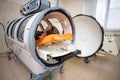 Young guy in a hyperbaric chamber, oxygen treatment