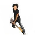 Young guy jumping with electric bass guitar Royalty Free Stock Photo