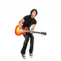 Young guy jumping with electric guitar Royalty Free Stock Photo