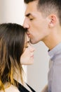 Guy kisses his beloved girl on the forehead Royalty Free Stock Photo