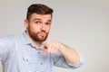 Young guy making selfie and pointing you with finger Royalty Free Stock Photo