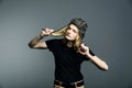 Young guy model posing in a tankman helmet. A portrait of a man