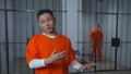 Asian prisoner speaks to camera. Interview with the criminal