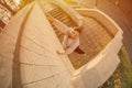 A young guy overcomes obstacles, climbing on concrete walls