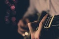 A young guy playing blues on an electric guitar. close-up.