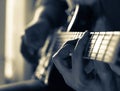 A young guy playing blues on an electric guitar. close-up.