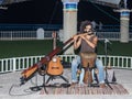 A young guy plays a flute in the evening on the waterfront in the city of Nahariya, in Israel