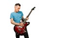 Young guy plays on a retro guitar isolated on a white background Royalty Free Stock Photo