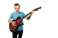 Young guy plays on a retro guitar isolated on a white background Royalty Free Stock Photo