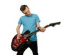Young guy plays on a retro guitar isolated on a white background Royalty Free Stock Photo