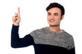 Young guy pointing upwards Royalty Free Stock Photo