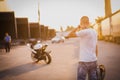 A young guy and a powerful sports bike. Photo on the street Royalty Free Stock Photo