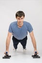 Young guy pushed off the floor on legs Royalty Free Stock Photo