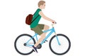 A young guy with a backpack rides a bike