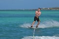 Young Guy Riding a Wakeboard Off the Coast of Aruba Royalty Free Stock Photo