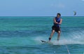 Young Guy Riding a Wakeboard in Tropical Waters Royalty Free Stock Photo