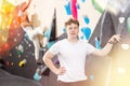 Teen guy posing against climbing wall Royalty Free Stock Photo