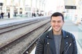 Young guy in train station Royalty Free Stock Photo