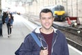 Young guy in train station Royalty Free Stock Photo