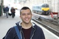 Young guy in train station Royalty Free Stock Photo
