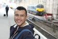 Young guy in train station Royalty Free Stock Photo
