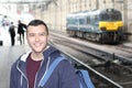 Young guy in train station Royalty Free Stock Photo