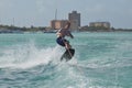 Young Guy Jumping While Wakeboarding in Aruba