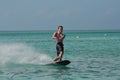 Young Guy Wakeboarding in the Tropical Blue Waters of Aruba Royalty Free Stock Photo