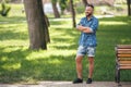 Young guy walking in the spring park. Sunny day. Vesna.Funny guy. A good mood.