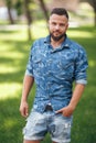 Young guy walking in the spring park. Sunny day. Vesna.Funny guy. A good mood.