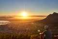 Young guy watching the sunrise over the city Royalty Free Stock Photo