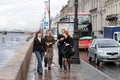 The young guys and girls on the Neva riverside in Saint-Petersburg